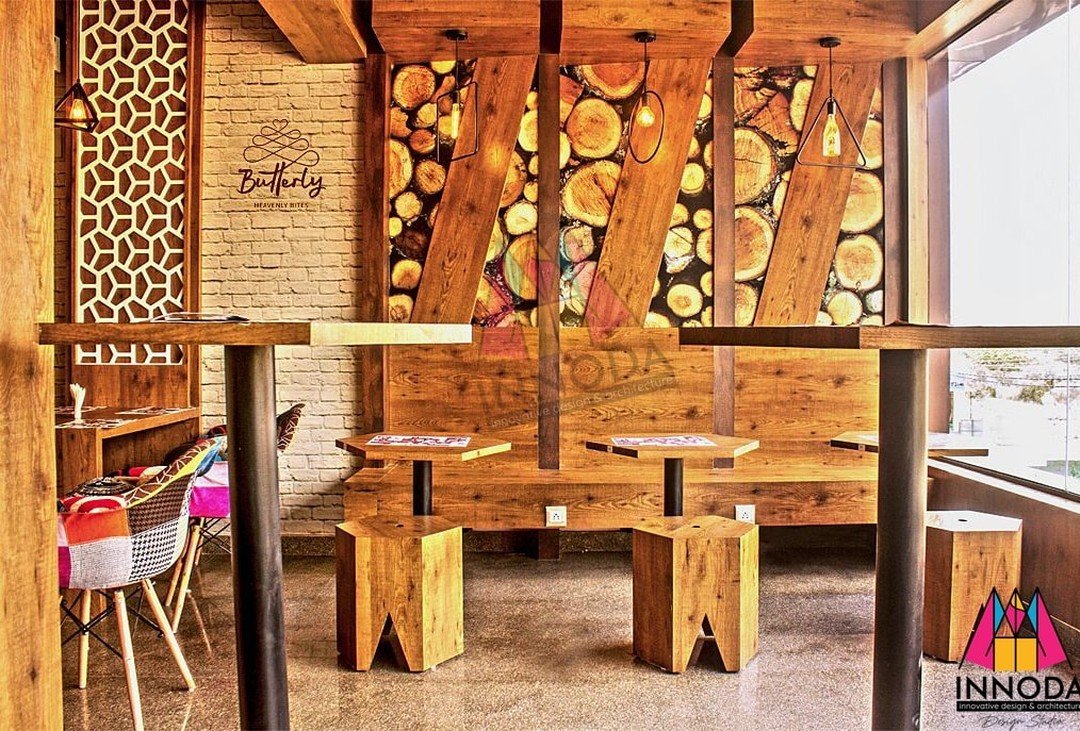 Butterfly Cafe raw timber log slice feature wall